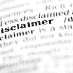 close up on disclaimer word in dictionary